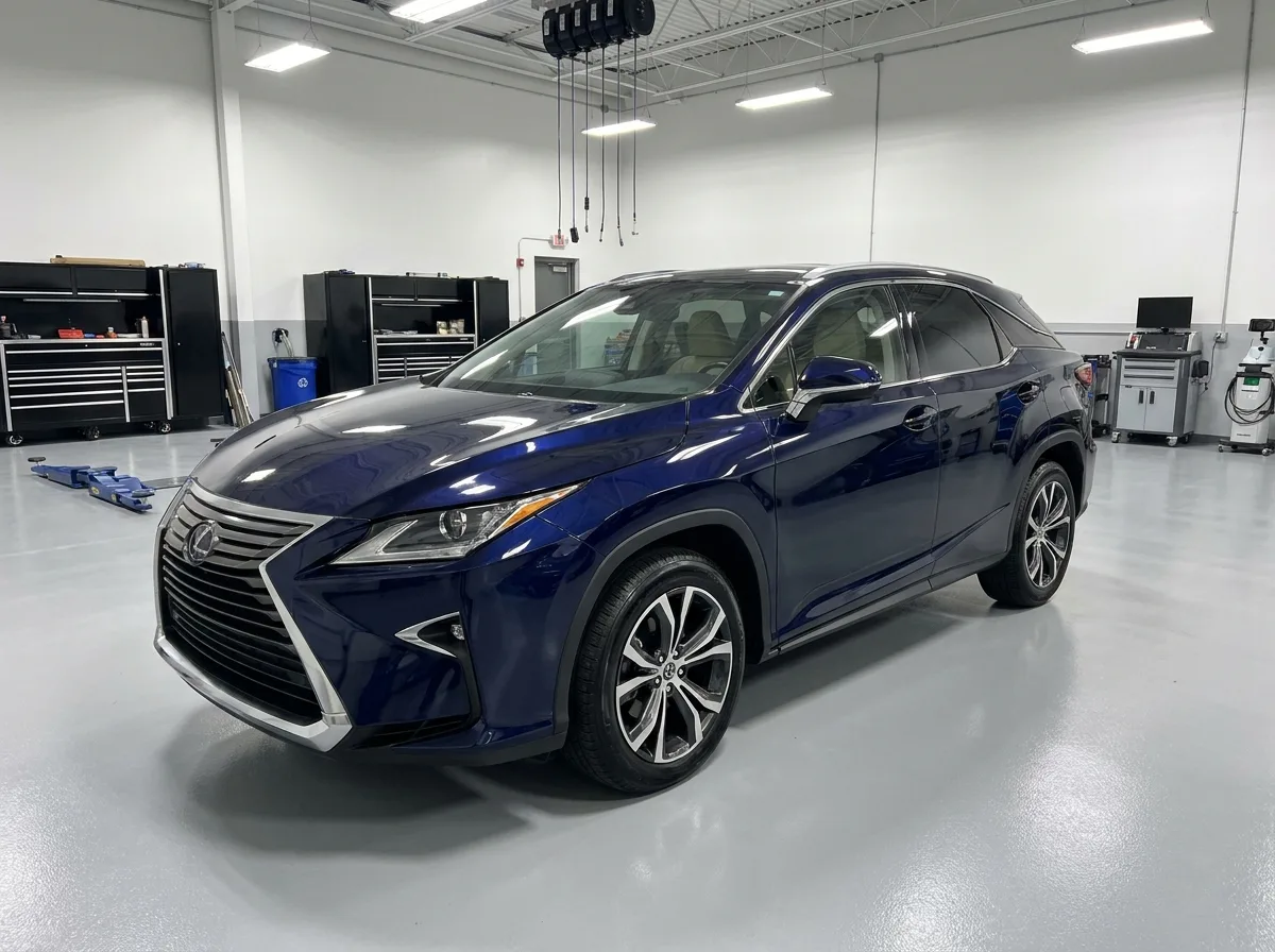 Navy Lexus SUV in a bright modern collision repair bay at Stow Smash Repairs